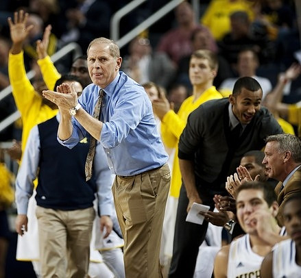John Beilein, Jon Horford (15), Jeff Meyer, and Mitch McGary (4)