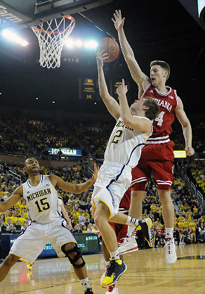 Jon Horford (15) and Spike Albrecht (2)