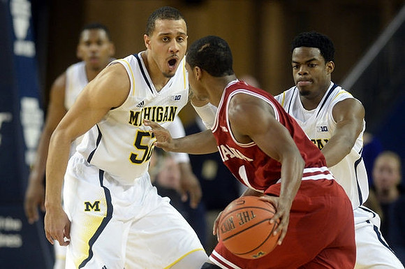 Jordan Morgan (52) and Derrick Walton Jr. (10)