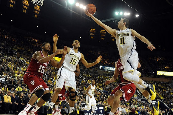 Jon Horford (15), Zak Irvin (21), and Nik Stauskas (11)