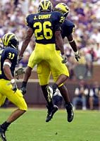 Julius Curry (26), Braylon Edwards (80) and Zia Combs (31)