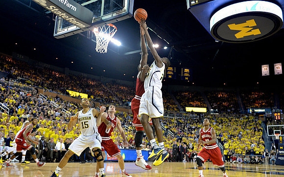Jon Horford (15) and Caris LeVert (23)