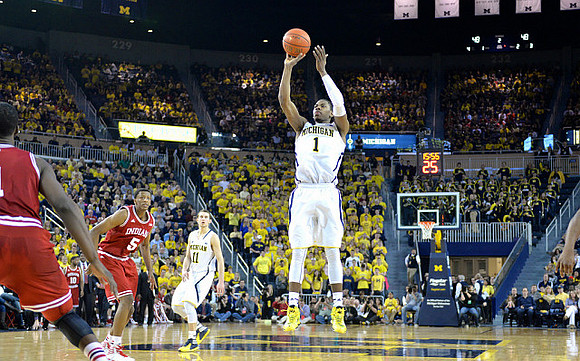 Glenn Robinson III (1) and Nik Stauskas (11)