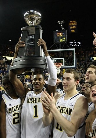 Caris LeVert (23), Derrick Walton Jr. (10), and Nik Stauskas (11)