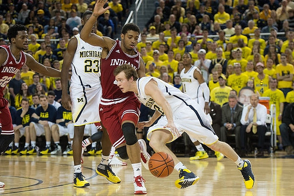 Caris LeVert (23), Spike Albrecht (2), Glenn Robinson III (1), and John Beilein