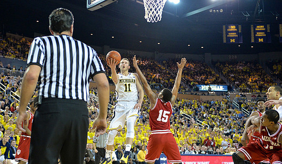 Nik Stauskas (11) and Jordan Morgan (52)