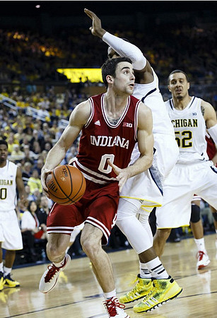 Derrick Walton Jr. (10), Glenn Robinson III (1), and Jordan Morgan (52)