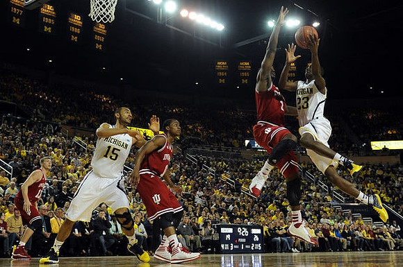 Jon Horford (15) and Caris LeVert (23)