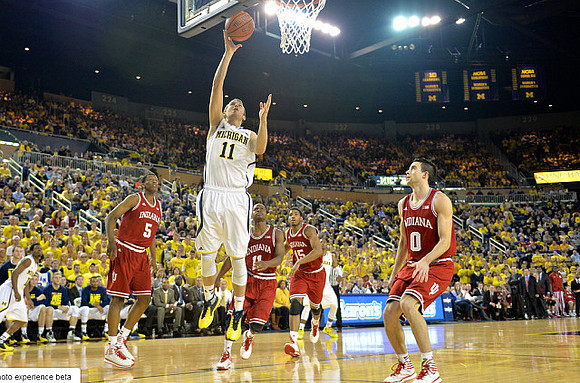 Nik Stauskas (11) and Derrick Walton Jr. (10)