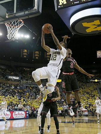 Muhammad-Ali Abdur-Rahkman (12), Spike Albrecht (2), and Ricky Doyle (32)