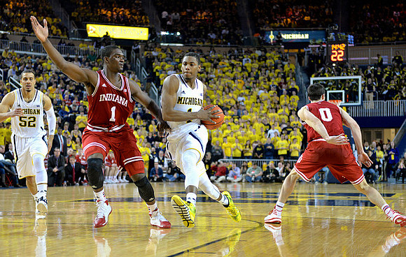 Jordan Morgan (52) and Glenn Robinson III (1)