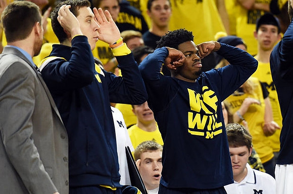 Sean Lonergan (20) and Derrick Walton Jr. (10)