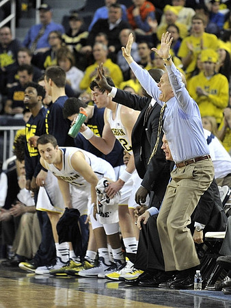 Andrew Dakich (11), Ricky Doyle (32), and John Beilein