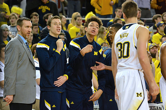 Austin Hatch (30) and Michigan Team