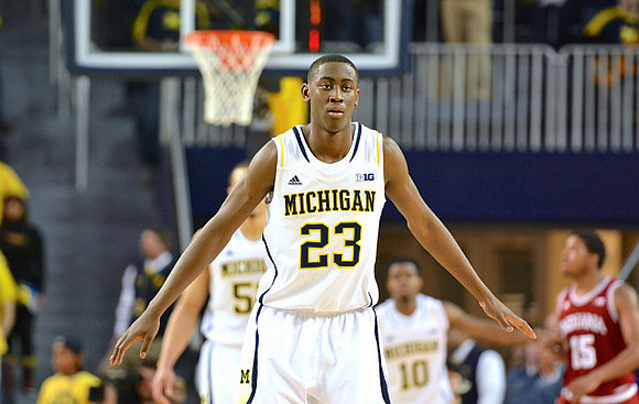 Caris LeVert (23), Jordan Morgan (52), and Derrick Walton Jr. (10)