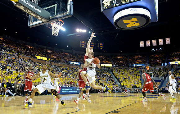 Jon Horford (15), Spike Albrecht (2), and Glenn Robinson III (1)