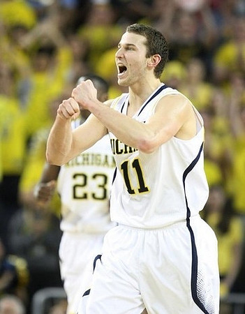 Nik Stauskas (11) and Caris LeVert (23)