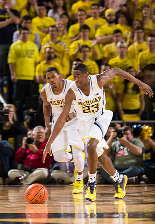 Glenn Robinson III (1) and Caris LeVert (23)