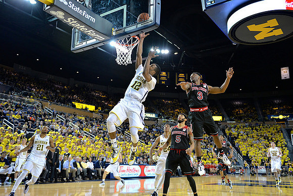 Andrew Dakich (11), Zak Irvin (21), Muhammad-Ali Abdur-Rahkman (12), Aubrey Dawkins (24), and Ricky Doyle (32)