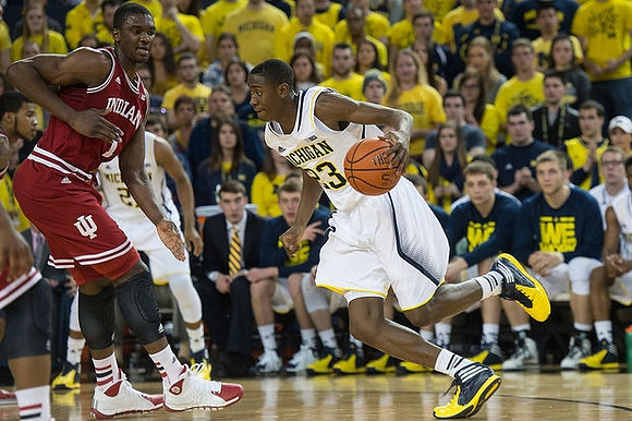 Zak Irvin (21) and Caris LeVert (23)