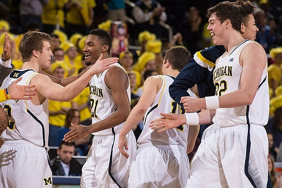 Spike Albrecht (2), Zak Irvin (21), Andrew Dakich (11), D.J. Wilson (5), and Ricky Doyle (32)