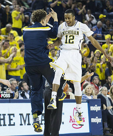 D.J. Wilson (5) and Muhammad-Ali Abdur-Rahkman (12)