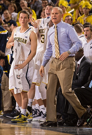 Andrew Dakich (11), Ricky Doyle (32), and John Beilein