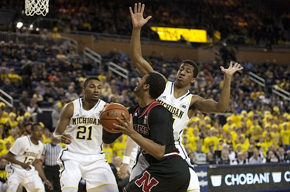 Muhammad-Ali Abdur-Rahkman (12), Zak Irvin (21), and Aubrey Dawkins (24)