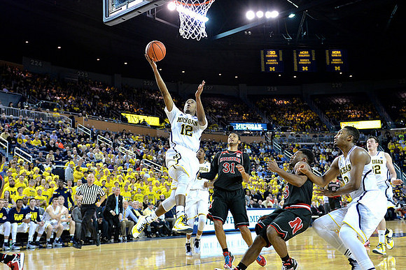 Muhammad-Ali Abdur-Rahkman (12), Zak Irvin (21), and Ricky Doyle (32)