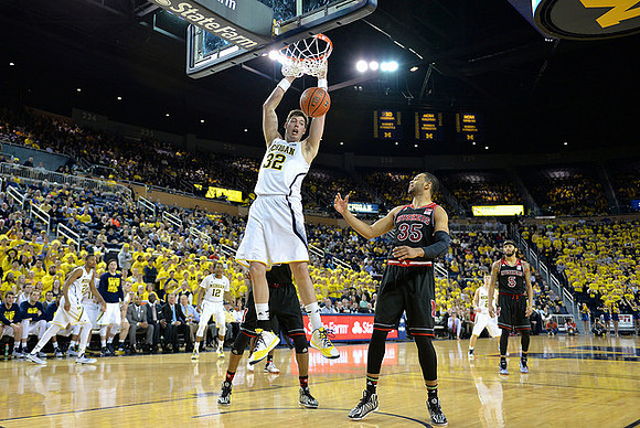 Zak Irvin (21), Muhammad-Ali Abdur-Rahkman (12), Ricky Doyle (32), and Spike Albrecht (2)