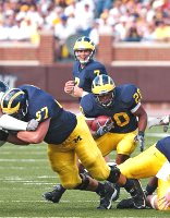 Michael Hart (20), Chad Henne (7), and Adam Kraus (57)