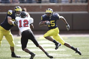 Steve Breaston (15) and Tyler Ecker (89)