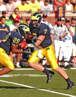 Michael Hart (20) and Chad Henne (7)