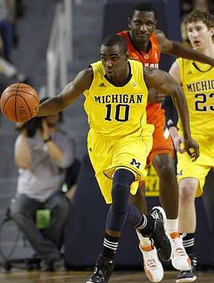 Tim Hardaway Jr. (10) and Evan Smotrycz (23)