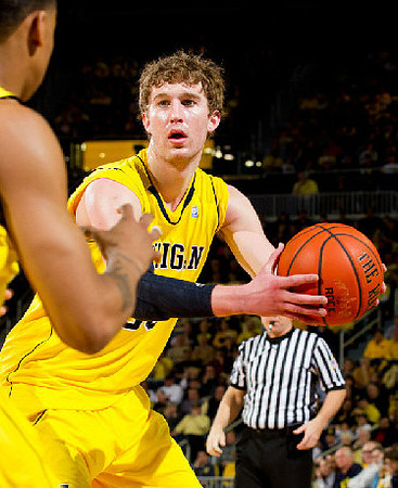 Trey Burke (3) and Evan Smotrycz (23)