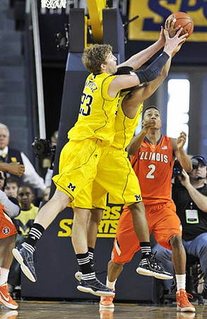 Evan Smotrycz (23) and Trey Burke (3)