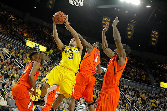 Matt Vogrich (13) and Trey Burke (3)