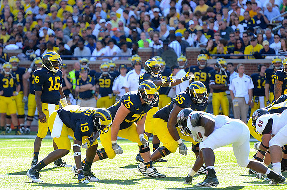 Denard Robinson (16), Devin Funchess (19), Michael Schofield (75), Patrick Omameh (65), and Vincent Smith (2)