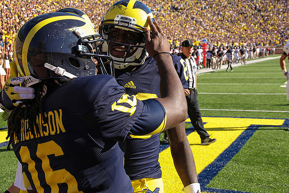 Denard Robinson (16) and Jerald Robinson (83)
