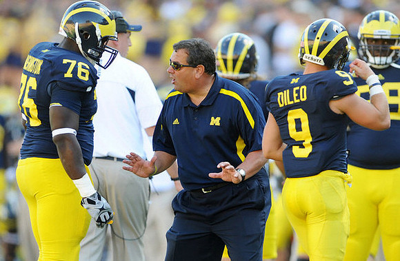 Quinton Washington (76), Brady Hoke, and Drew Dileo (9)
