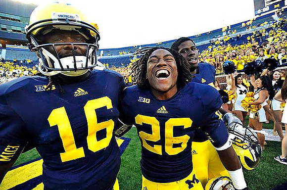 Denard Robinson (16) and Dennis Norfleet (26)