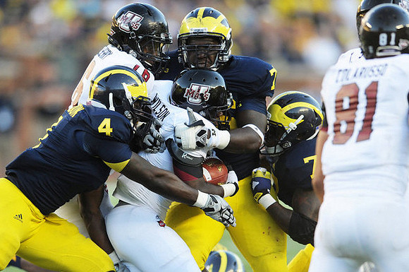 Cameron Gordon (4), Quinton Washington (76), and Brandin Hawthorne (7)