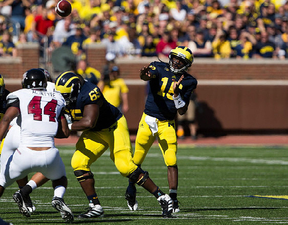 Patrick Omameh (65) and Denard Robinson (16)