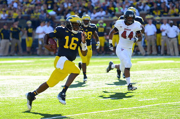 Denard Robinson (16) and Fitzgerald Toussaint (28)