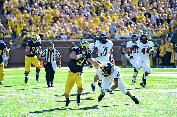 Taylor Lewan (77) and Drew Dileo (9)