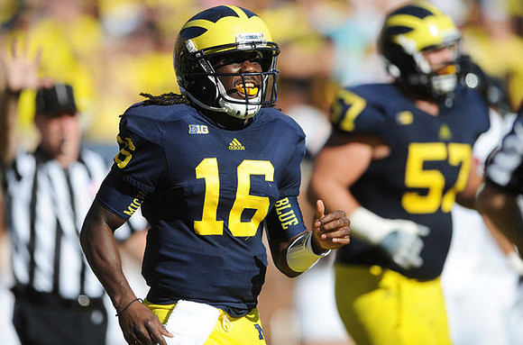 Denard Robinson (16) and Elliott Mealer (57)