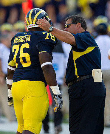 Quinton Washington (76) and Brady Hoke
