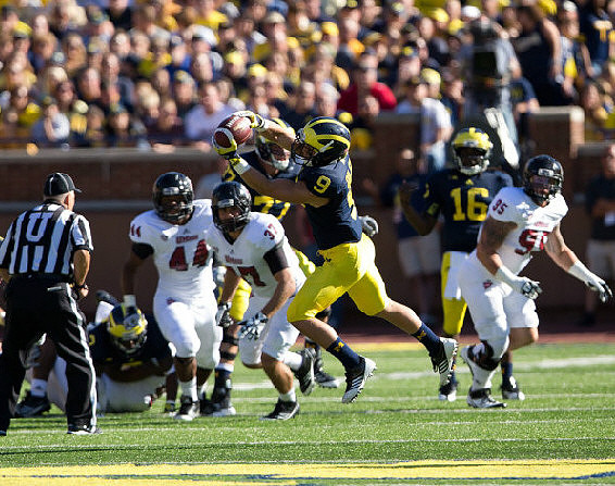 Drew Dileo (9) and Denard Robinson (16)
