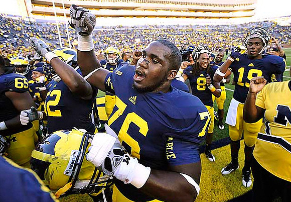 Patrick Omameh (65), Ricky Barnum (52), Quinton Washington (76), J.T. Floyd (8), and Devin Funchess (19)