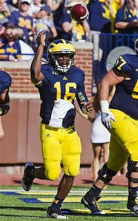 Denard Robinson (16) and Elliott Mealer (57)